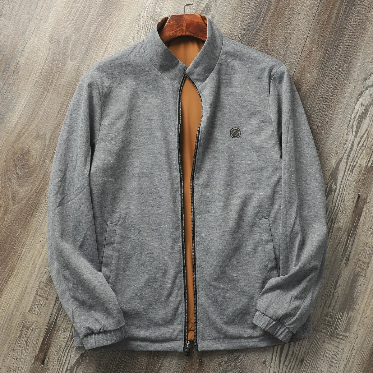 Men's stand collar casual jacket in Army Green colour on a hanger.