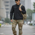 A black soft shell jacket for mountaineering and camping, shown in a cardigan style.