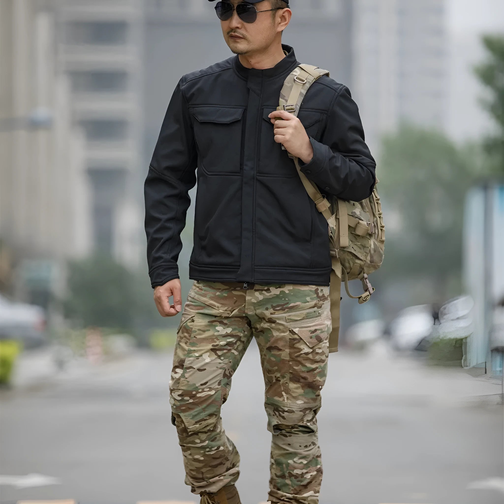 A black soft shell jacket for mountaineering and camping, shown in a cardigan style.