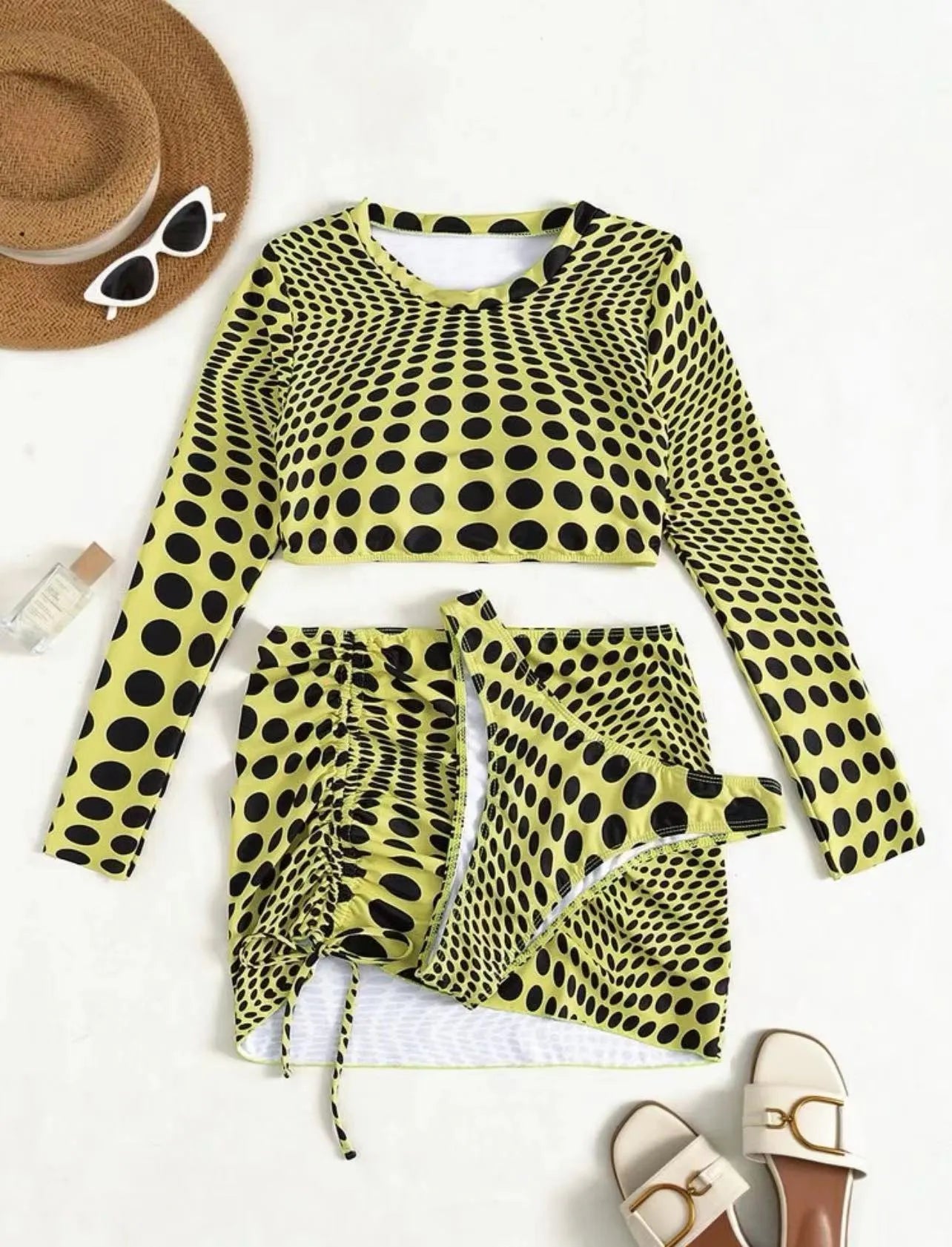 Green and yellow polka dot women's swimsuit three-piece set showing top, skirt, and bra
