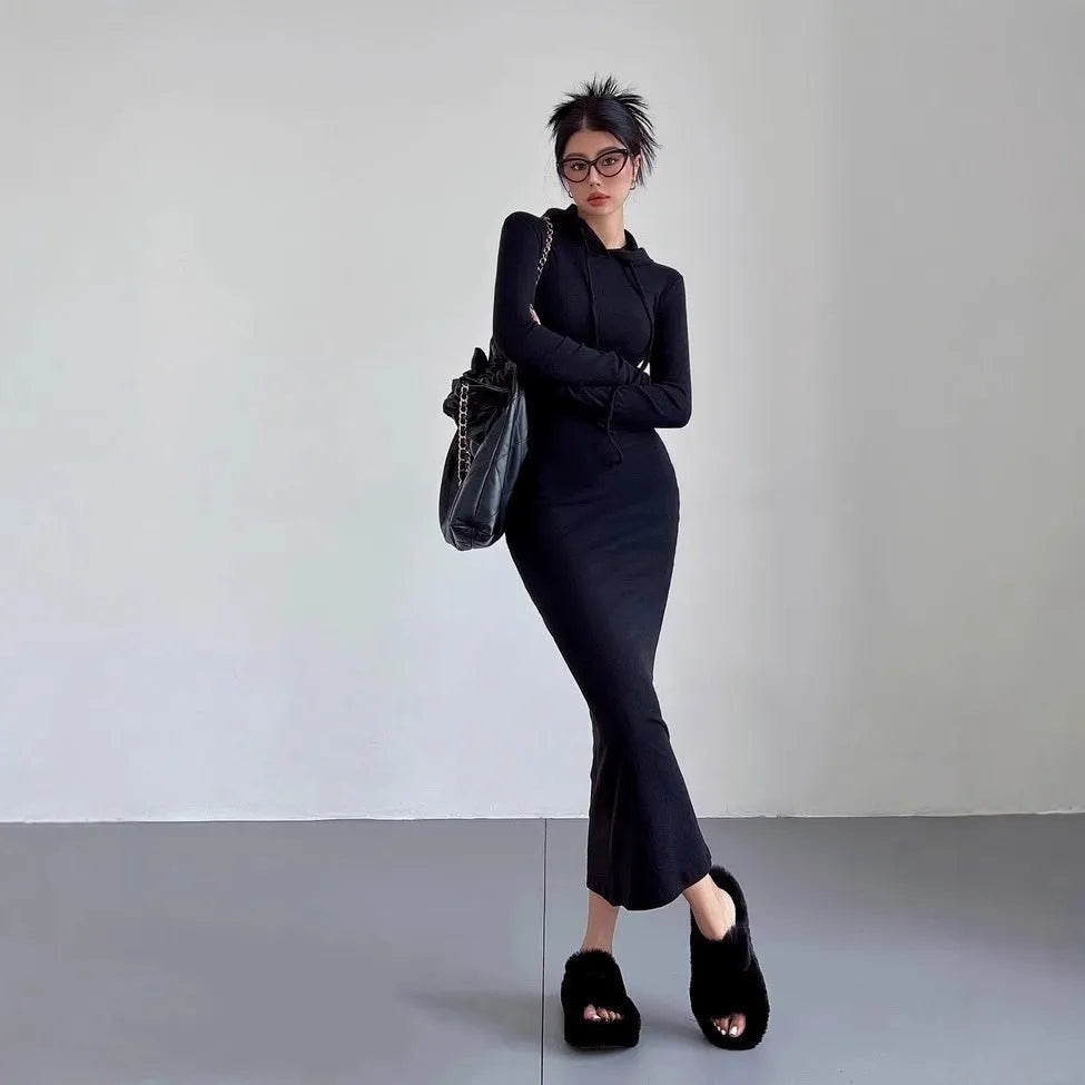 Women's long hooded dress with long sleeves and a sheath silhouette in polyester.