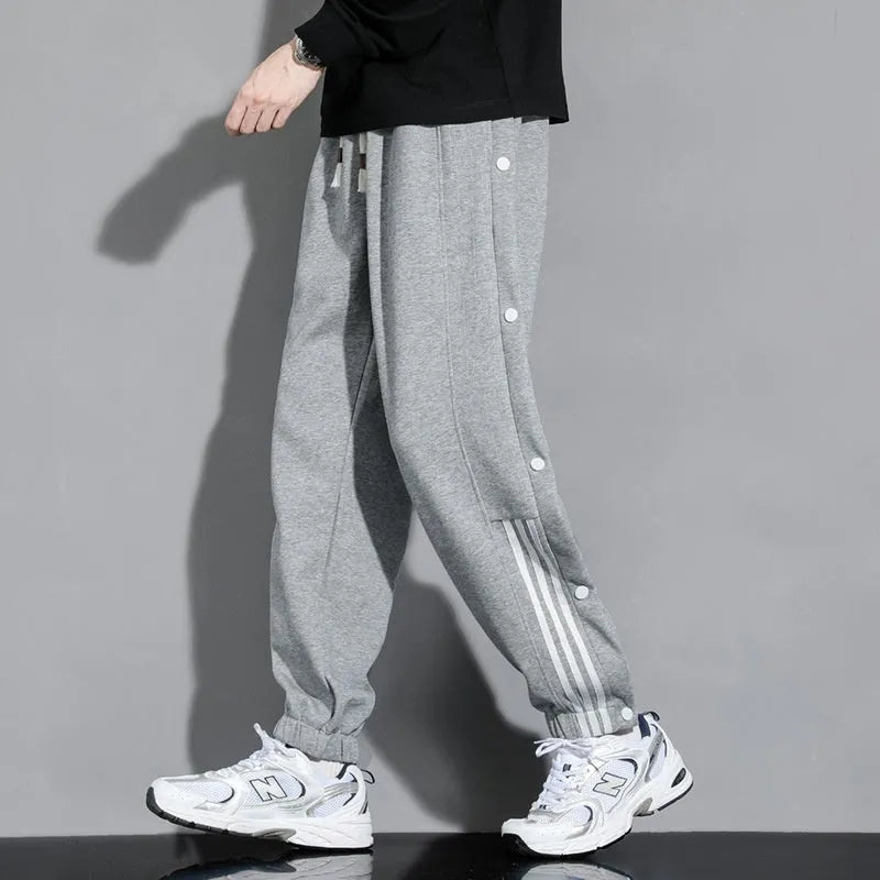 Men's loose fit sweatpants with ankle-tied cuffs in cotton blend fabric