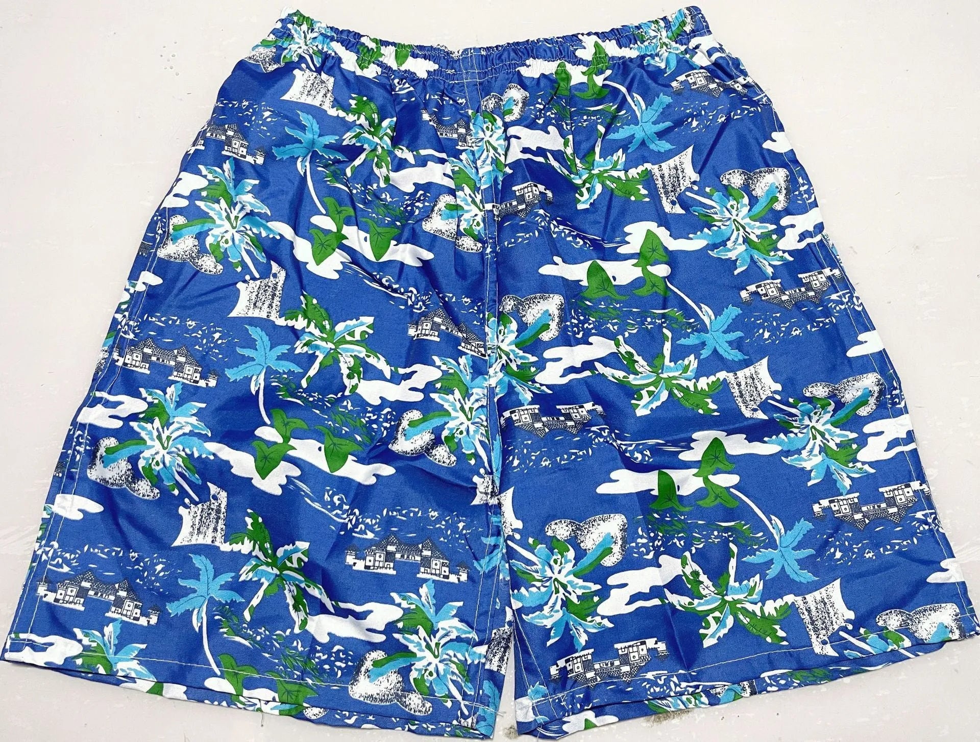 Men's floral print five-point swimming trunks in polyester fabric for pool and beach use
