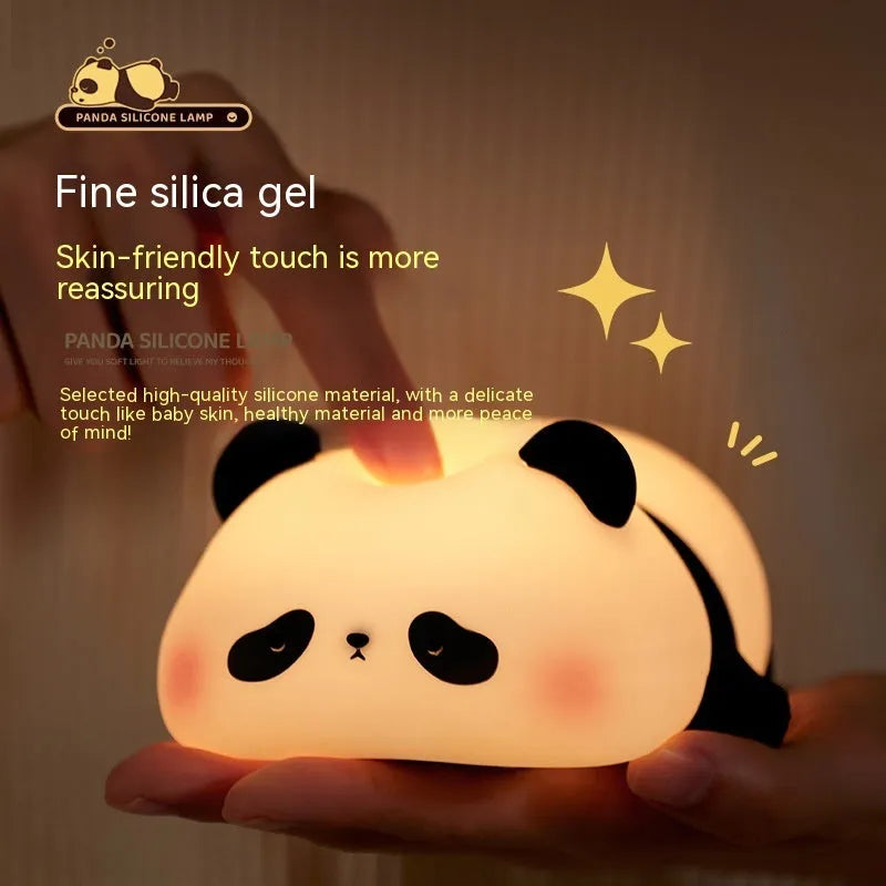 Panda-shaped night light with black and white silicone construction showing LED glow