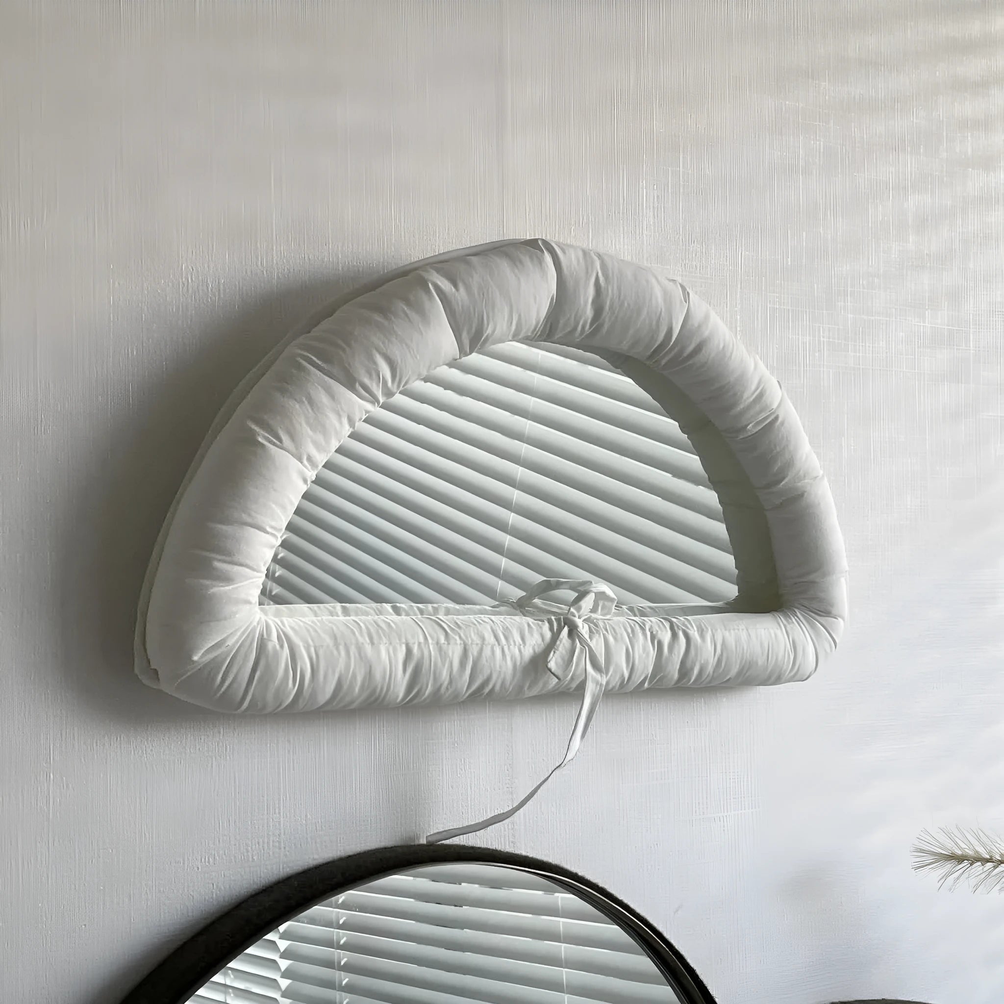 Hanging soft cotton-filled fabric mirror in solid colour for background use
