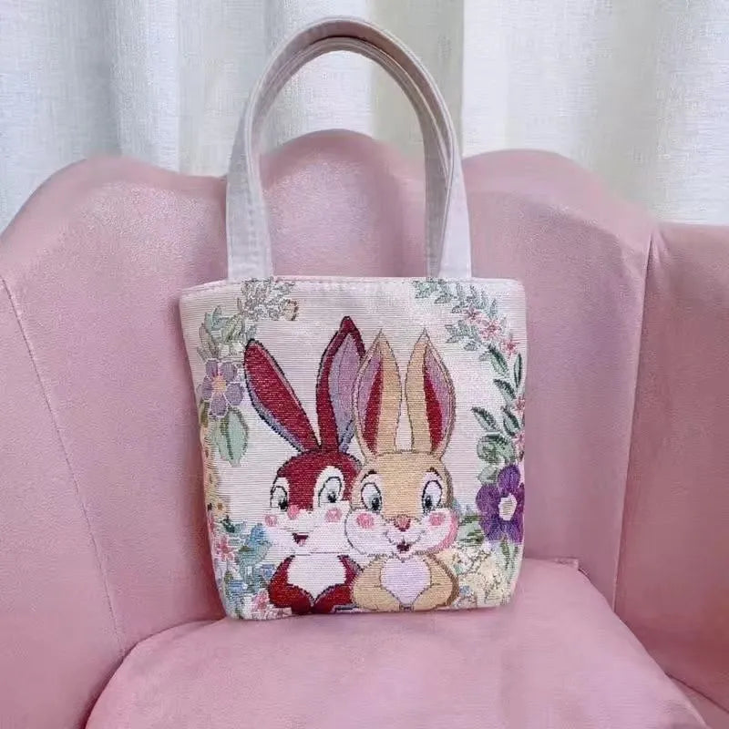 Double-sided gold wire embroidered handheld canvas tote bag in a choice of seven patterns and three sizes.