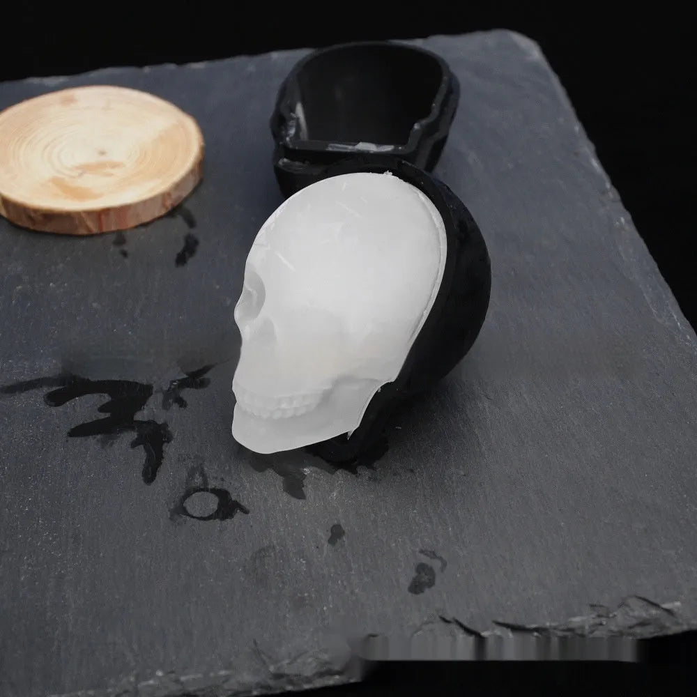 White silicone ice cube tray with detailed 3D skull mould cavities.