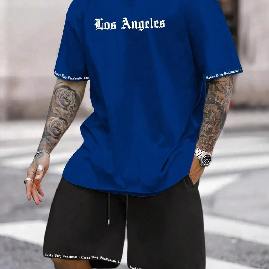 Man wearing a blue printed short-sleeve top and matching shorts from a quick-dry sports set.