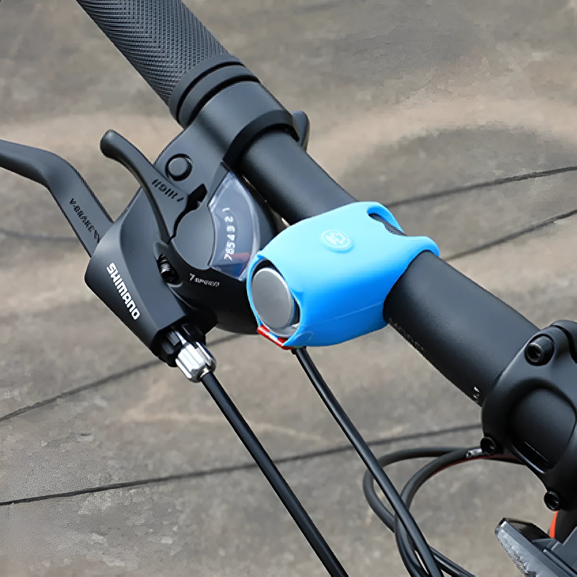 Bicycle electronic horn in plastic body with black colour, showing fixture and fitting for handlebar mounting