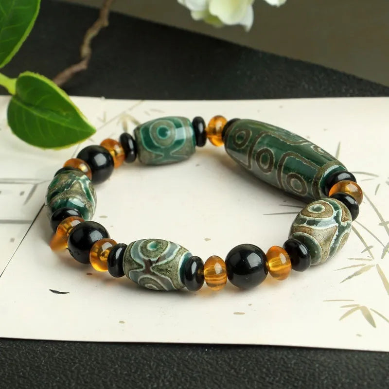 Distressed agate Tibet beads bracelet with three eye dzi design and polished stone beads