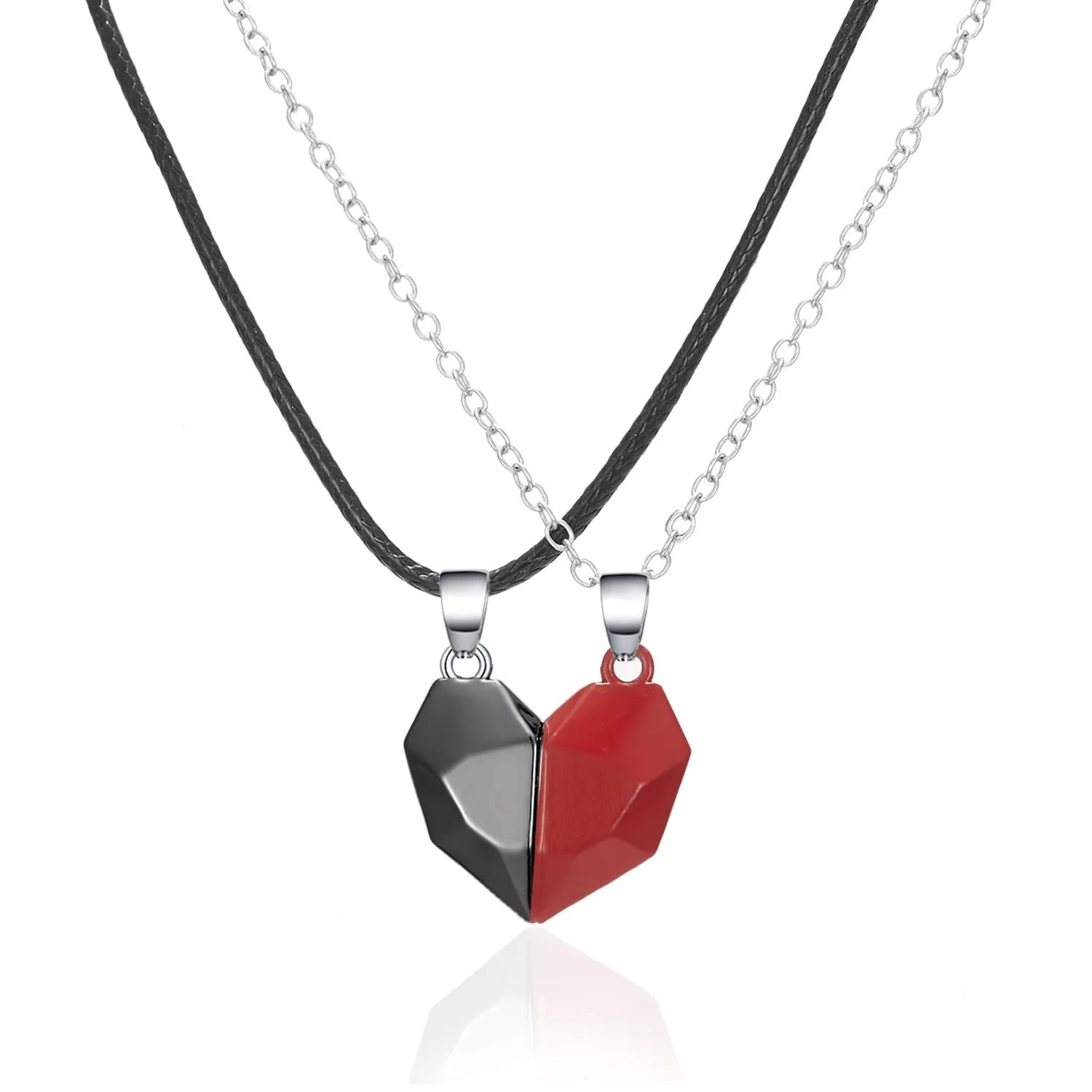 Gold-plated magnetic faceted heart pendant necklace in black and white on display