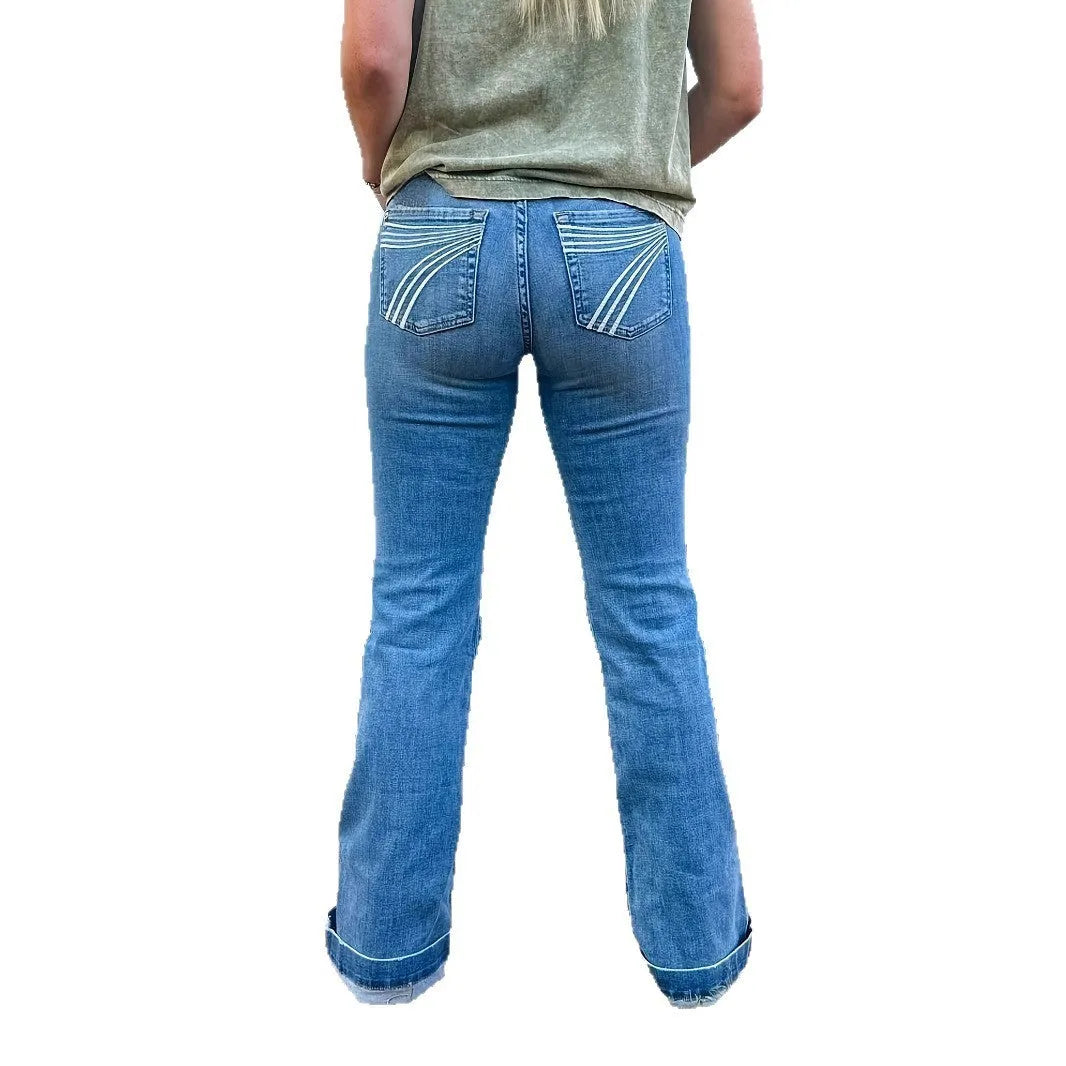 Slim fit elastic jeans with slightly flared leg and embroidery detail on blue denim.