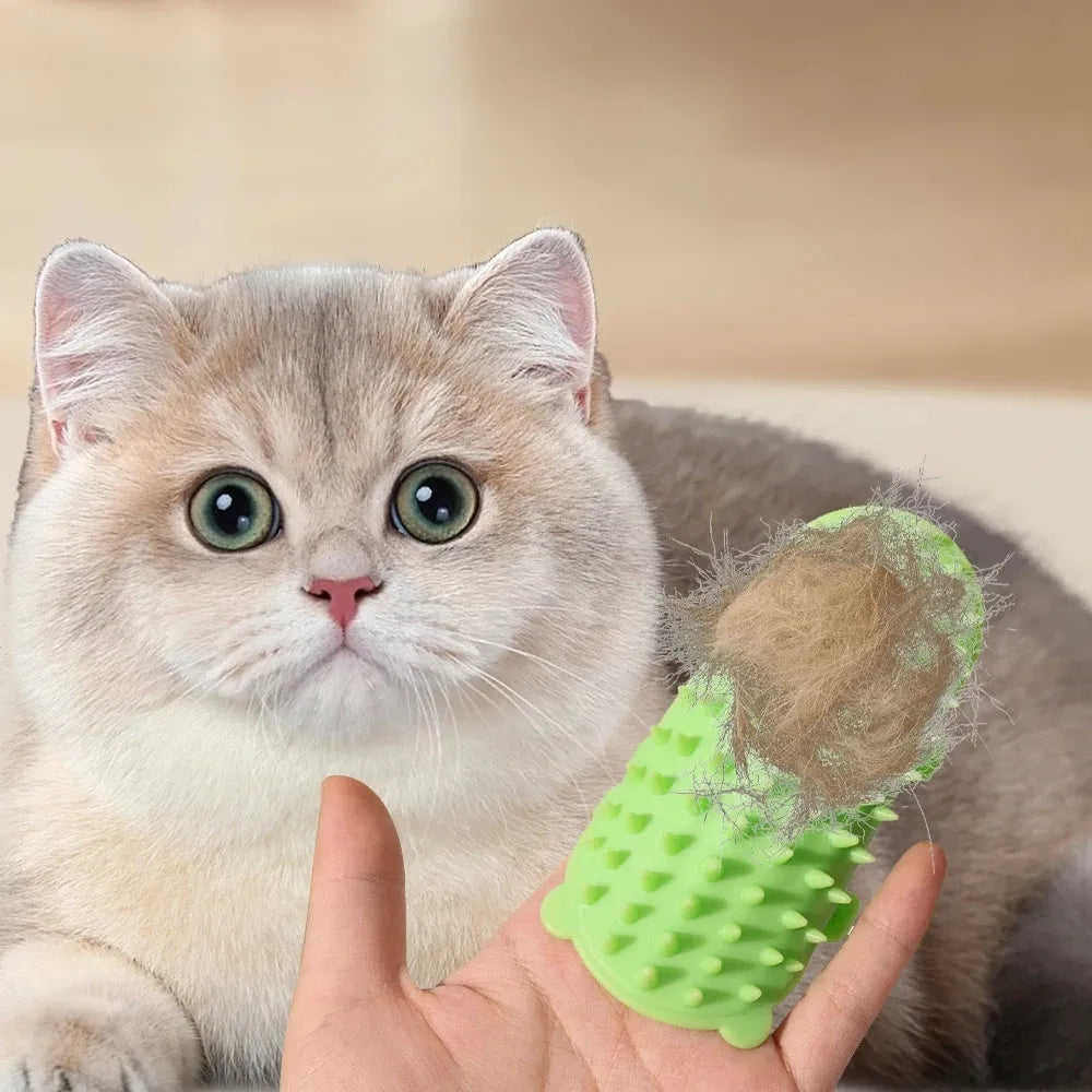 Silicone cat grooming massage comb with adjustable strap mounted on a table leg.