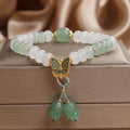 Green crystal women's bracelet with abacus beads and butterfly tassel decoration