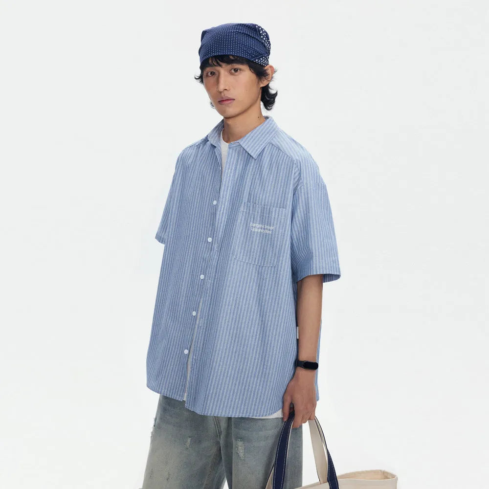 Blue striped short-sleeved overalls shirt in a loose cardigan style for casual wear.
