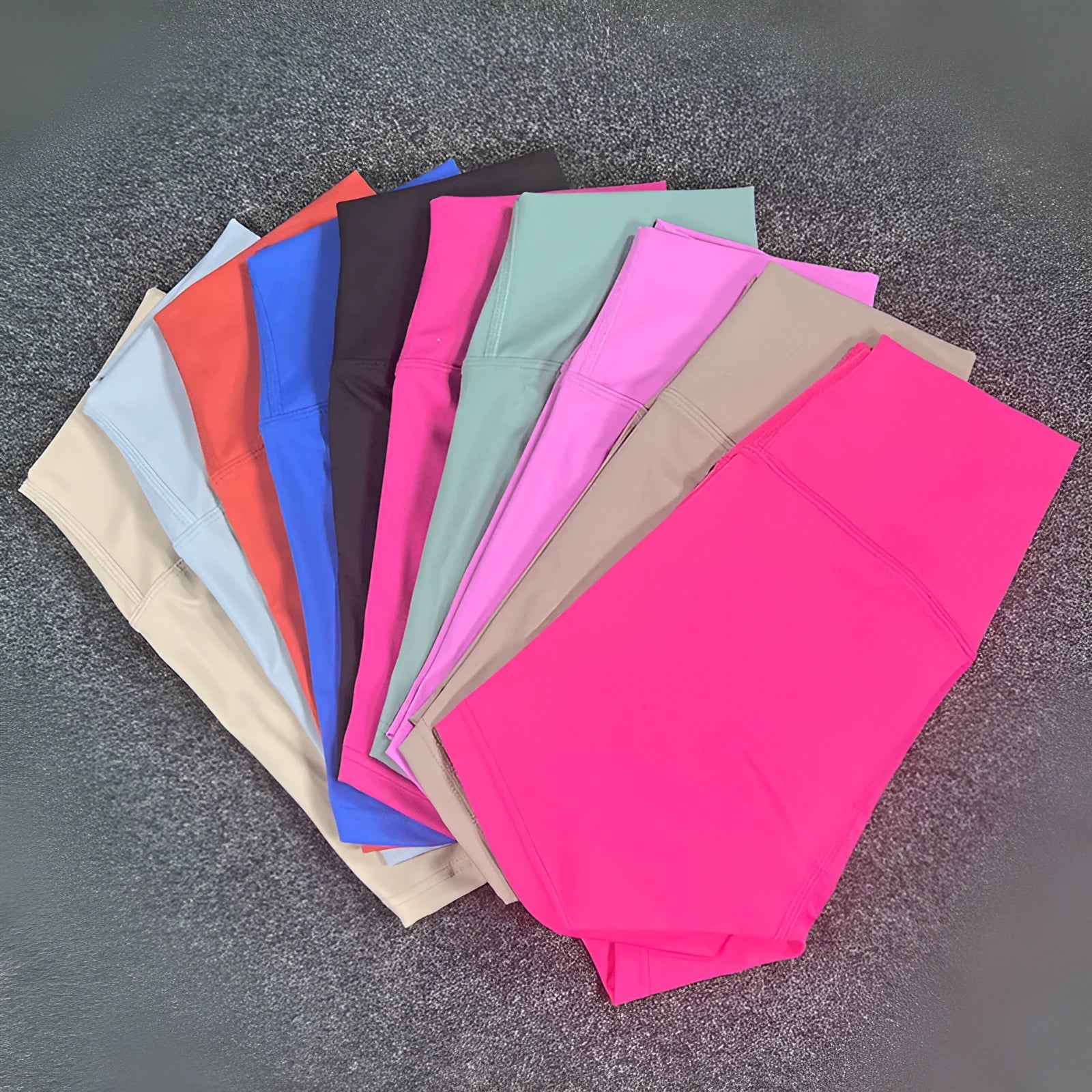 High-waisted women's yoga shorts in nylon fabric on a neutral background.