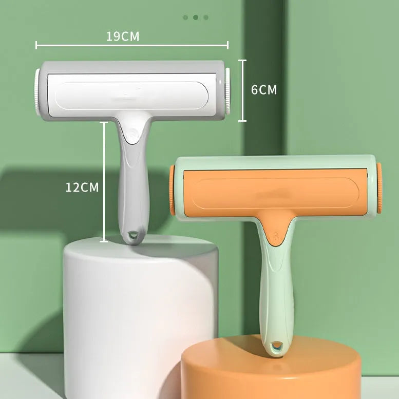 Two-way roller pet hair removal brush in green orange colour with ABS body and nylon fibre bristles on a beige sofa