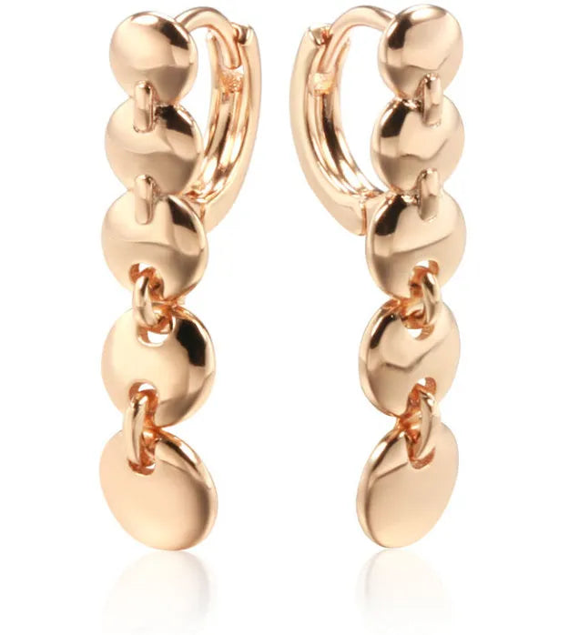 A pair of gold-coloured retro long round circle earrings with a woven copper texture.