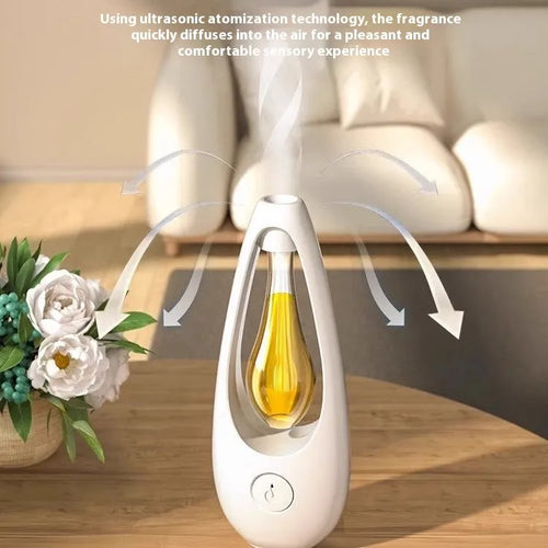 White ultrasonic aroma diffuser with control buttons and mist output, shown with essential oil bottle