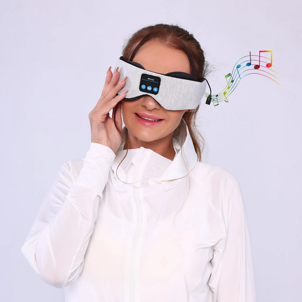 Grey polyester Bluetooth sleeping eye mask with long eyelashes design and no pressure fit.