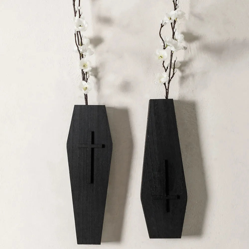 Wooden cross-shaped wall shelf decoration in black colour measuring 27 cm wide