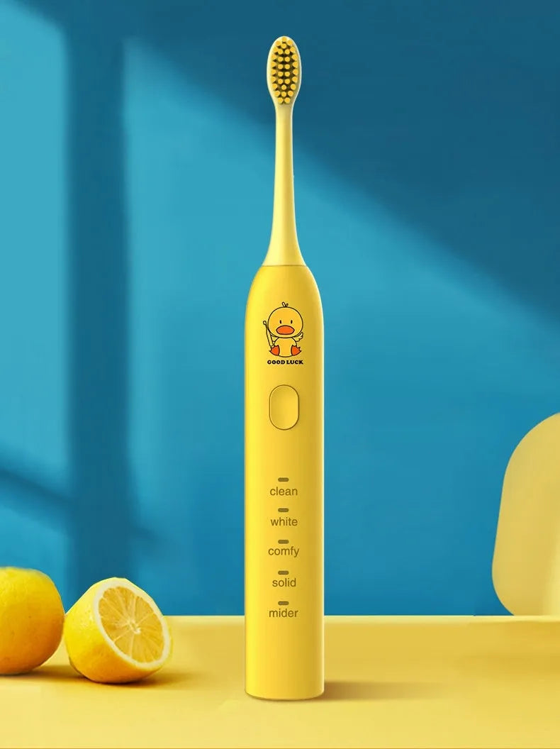 Yellow USB rechargeable electric toothbrush with small duck design and soft bristles