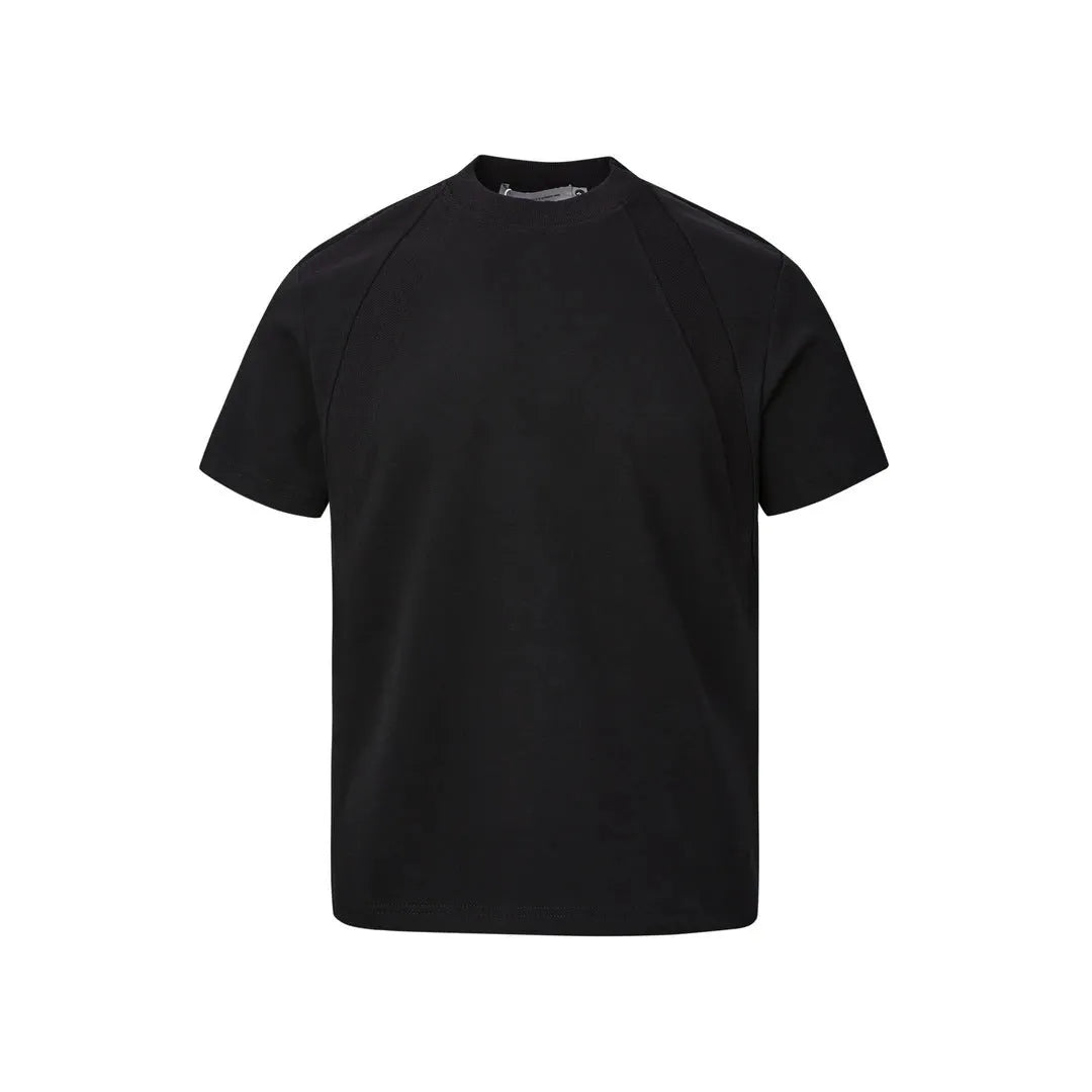 Man wearing a loose-fit black short sleeve top with visible air layer stitching detail.