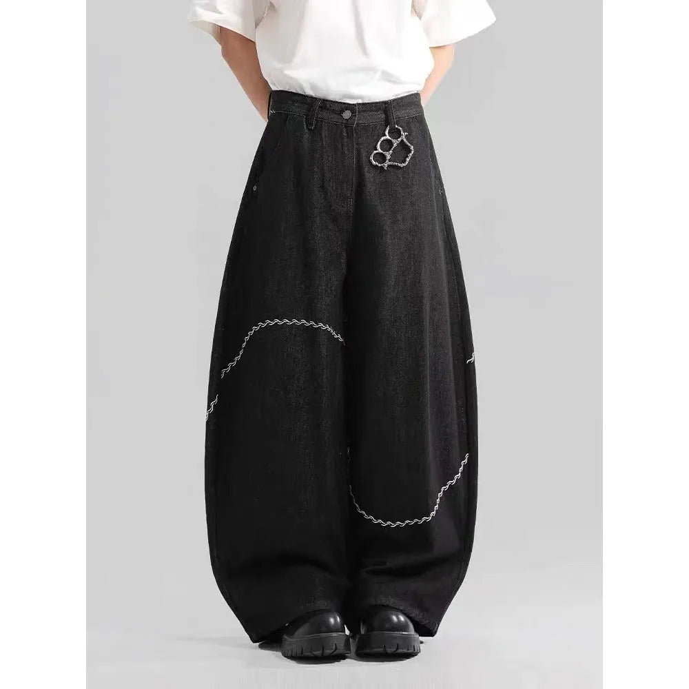 Black straight-leg jeans trousers with mid waist and zip placket closure on teenage model