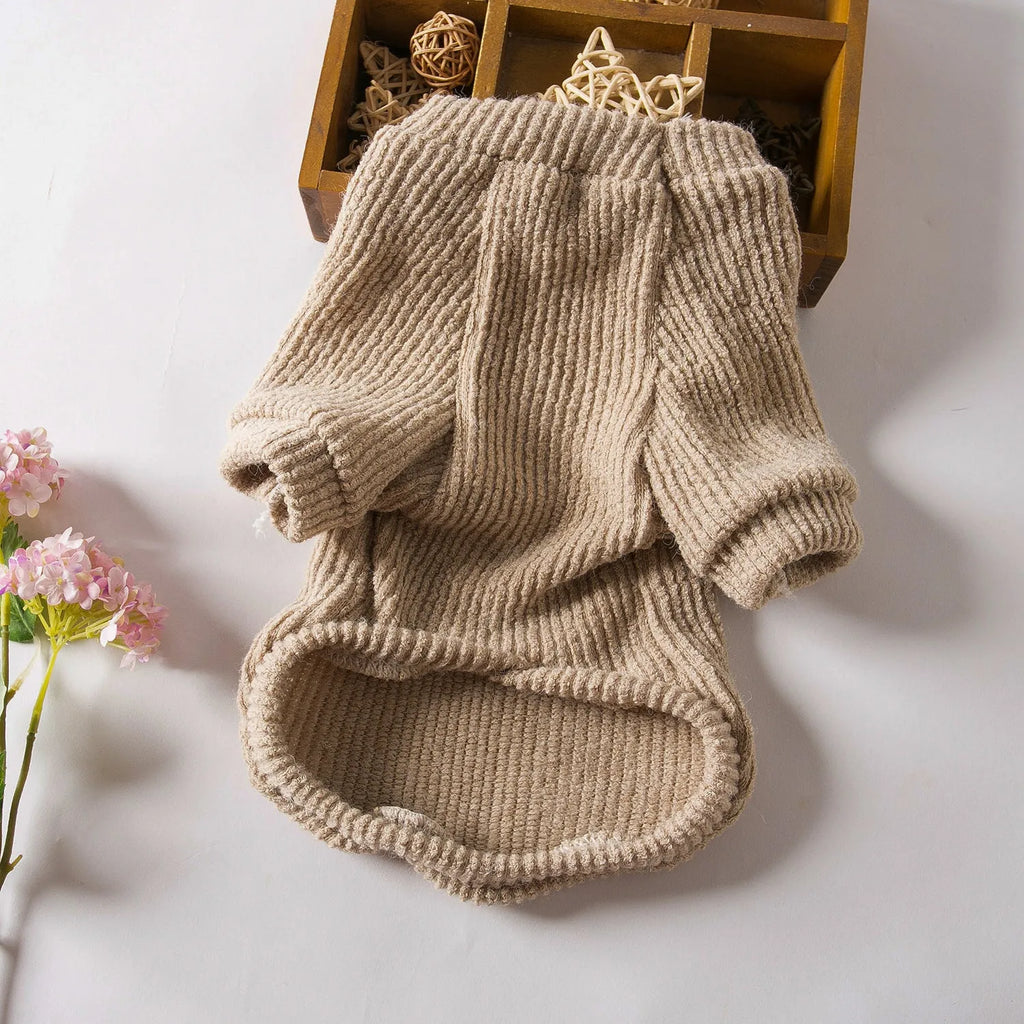 A brown cloth pullover sweater for a small dog on a white background.