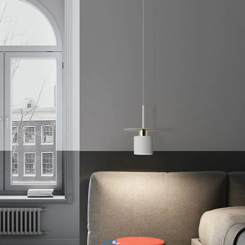 Modern minimalist black droplight pendant 20cm diameter on ceiling over a bedside table