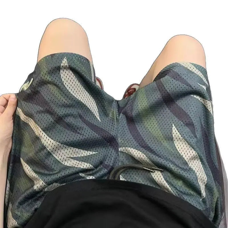 Men's camouflage pattern mesh shorts in cotton blend fabric with straight-leg cut