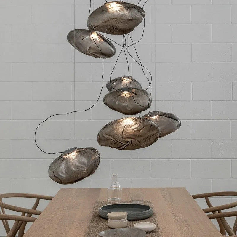Modern fabric chandelier with glass shade in amber, clear, or smoke grey colour, shown in large and small size options.