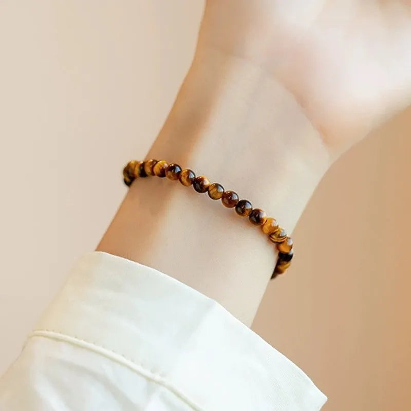 Tigereye stone bracelet with Chinese style geometric pattern in three bead sizes