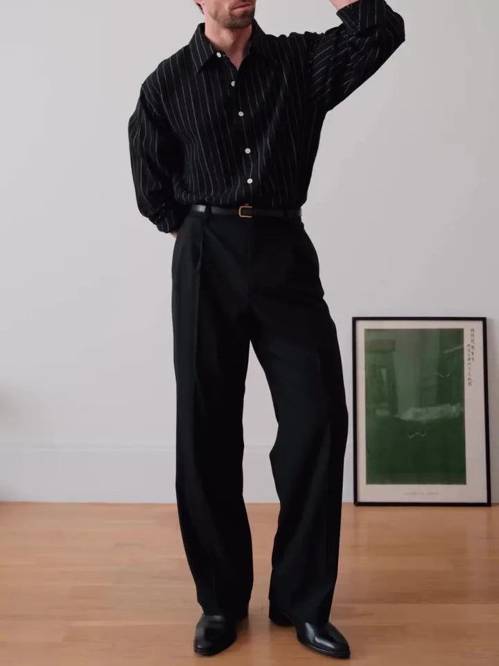 Black pinstriped button-down shirt with regular fit on a model.