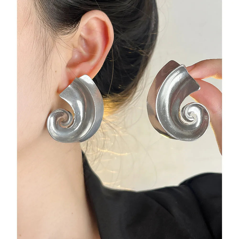 Geometric retro ear studs in gold and silver colours measuring 5cm with alloy construction