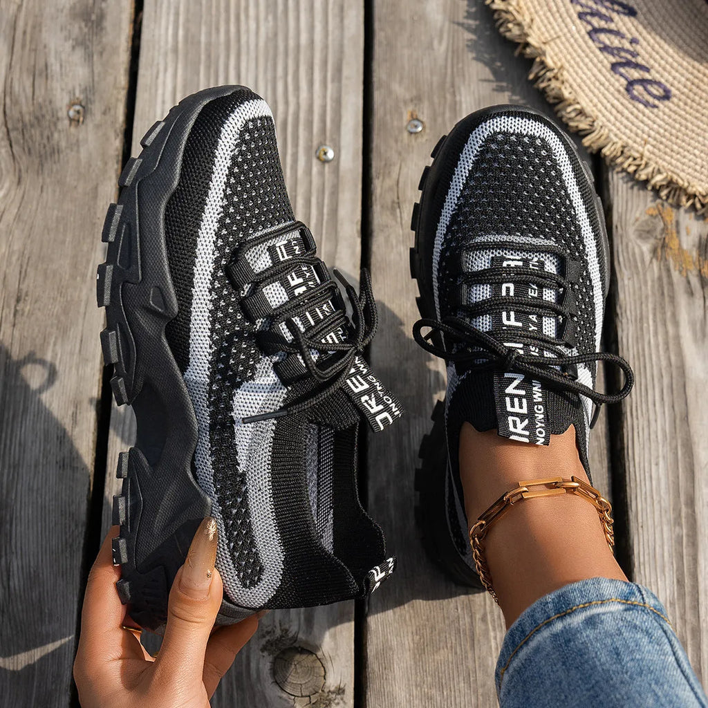 Women's Flyknit mesh lace-up sneakers in grey colour with low rubber sole