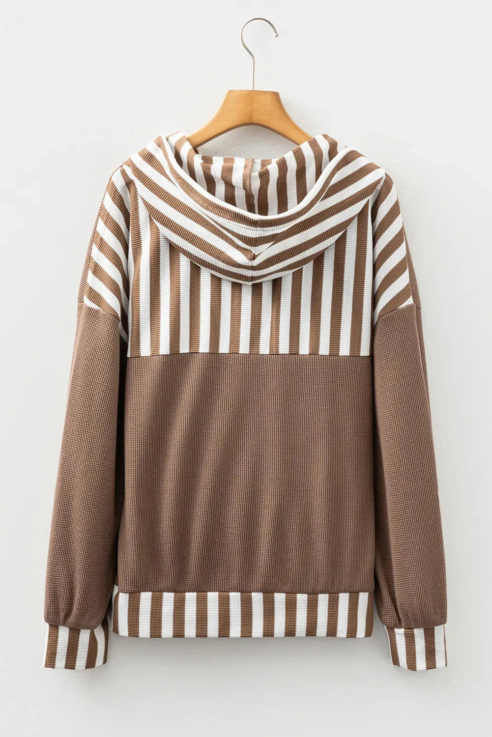 Straw yellow hoodie with waffle texture and striped patchwork design, showing front drawstring and button neck.