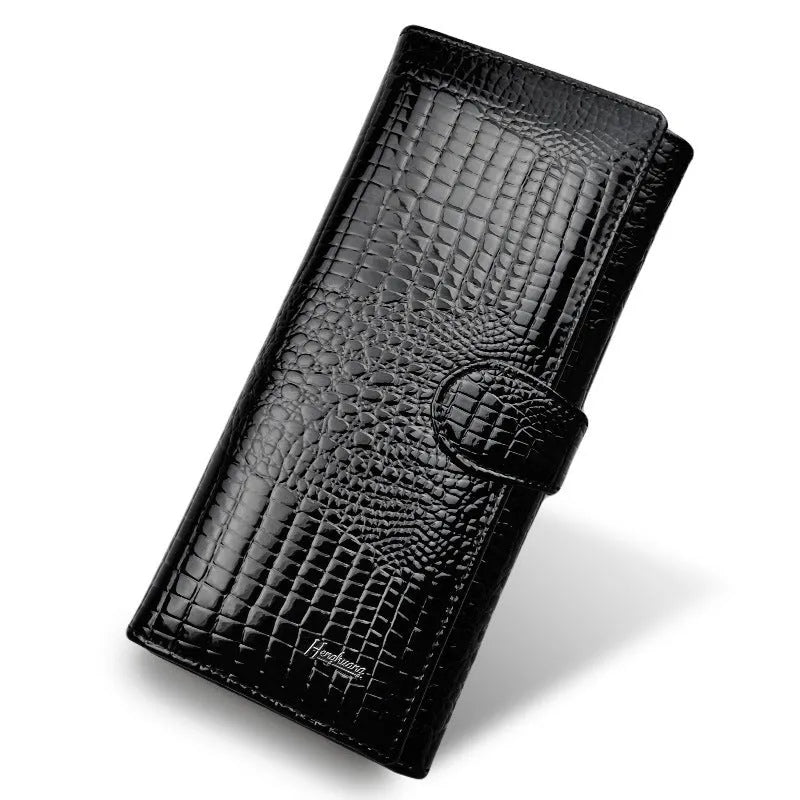 Women's red leather coin purse with crocodile pattern texture and a visible interior pigskin lining.