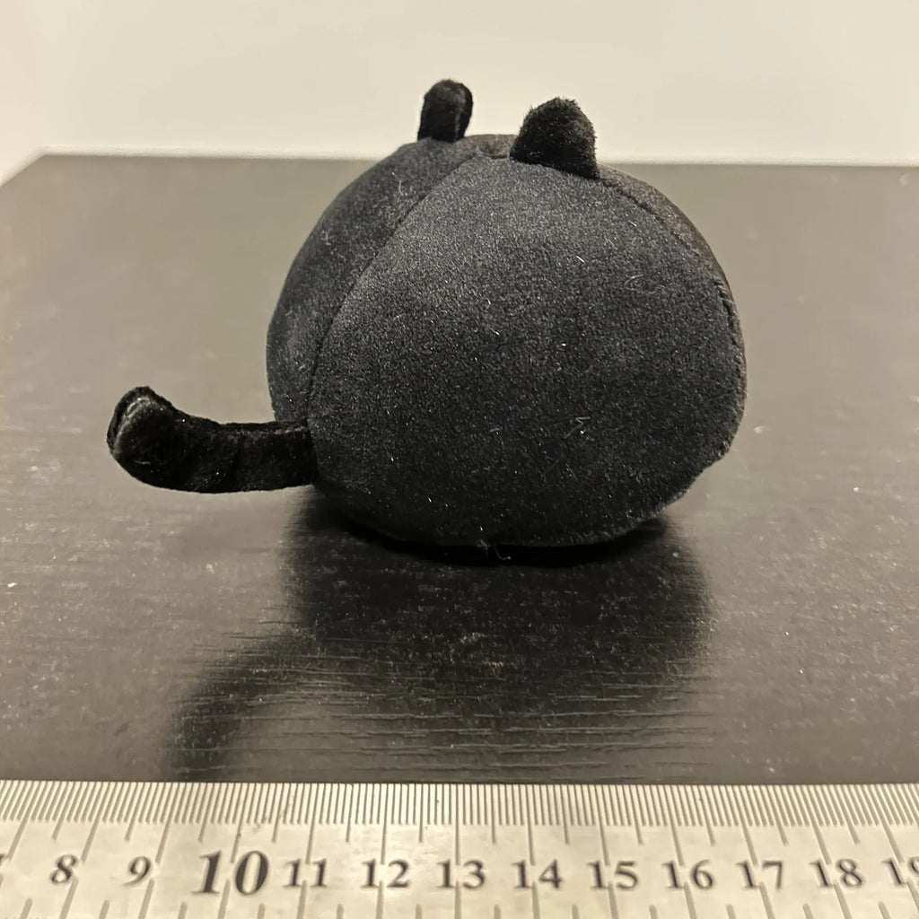 Black fluffy cat plush toy stuffed animal shown as a soft pillow cushion approximately 35cm long.