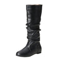 Women's flat ankle boots in black with round toe, high cylinder shaft, slip-on design and rubber sole.