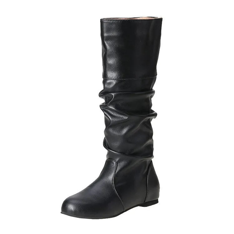 Women's flat ankle boots in black with round toe, high cylinder shaft, slip-on design and rubber sole.