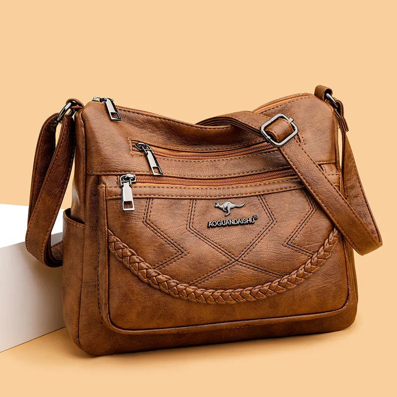 Soft leather shoulder bag in horizontal square shape with large capacity and internal zipper compartment