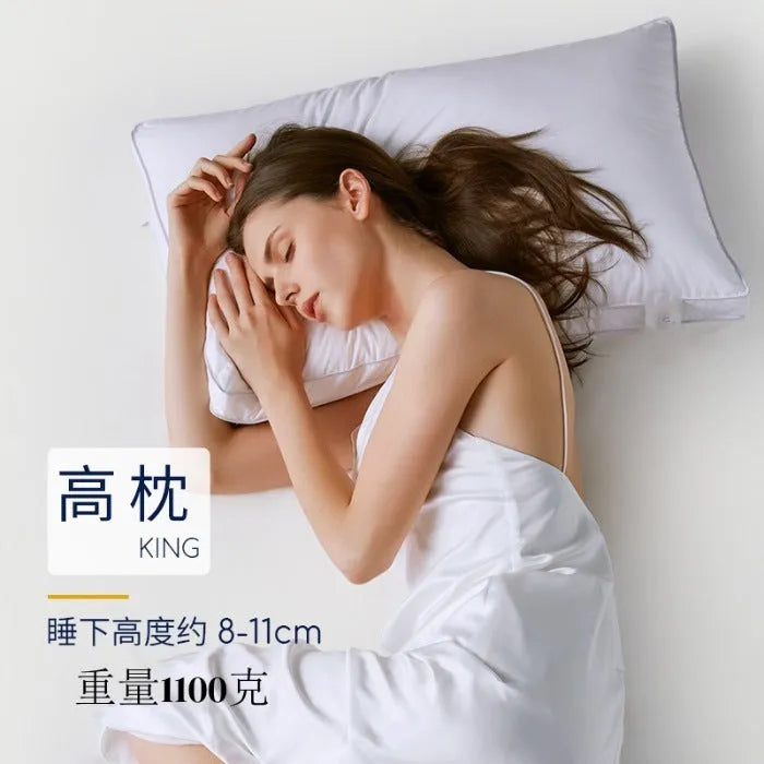 White hotel pillow with a satin stripe on a bed, showing low, medium, and high loft options.