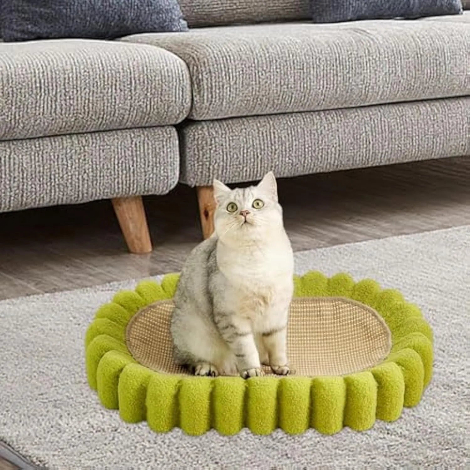 Green oval cat scratching pad and bed made from sisal material