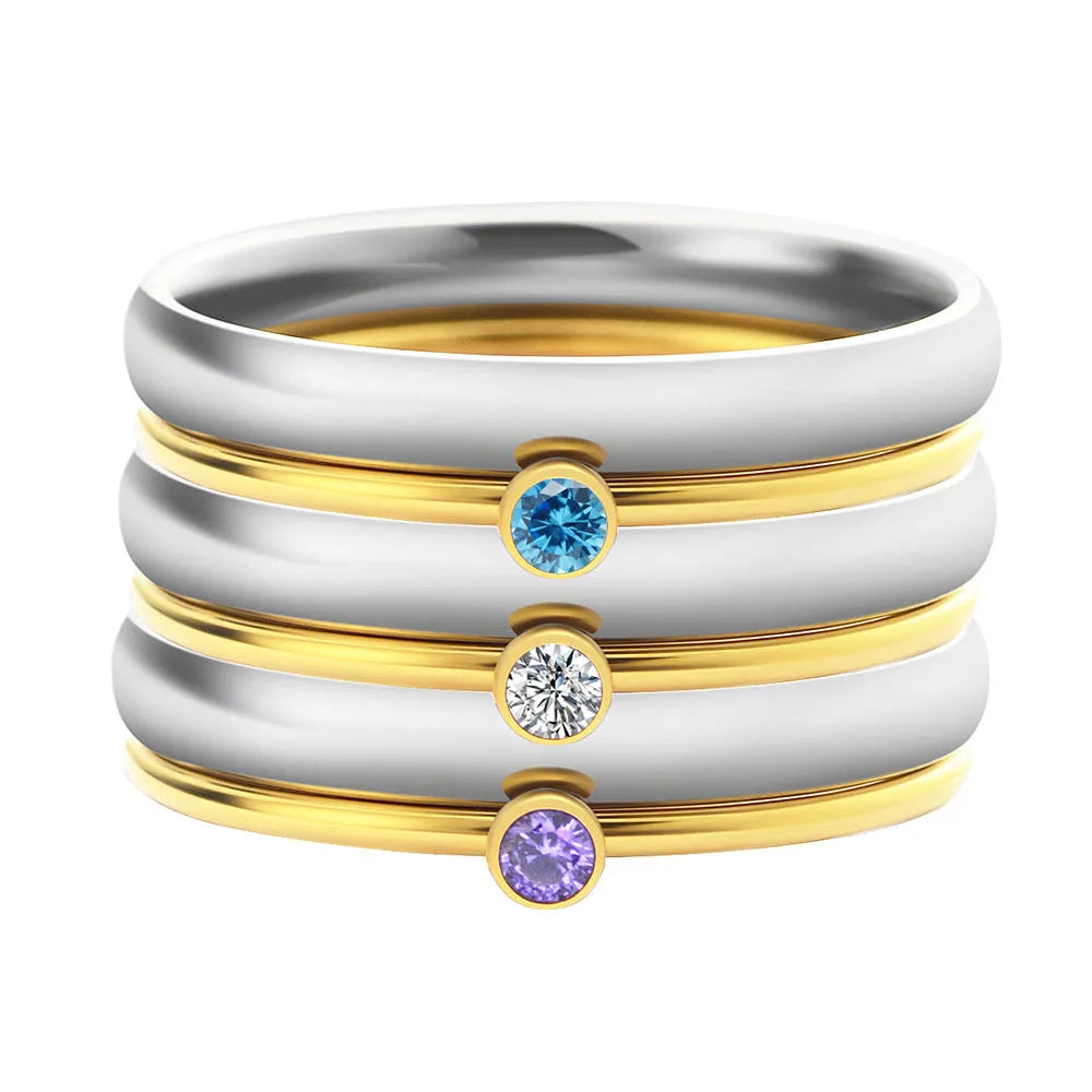 A titanium steel ring with an engraved December birthstone in a geometric design.