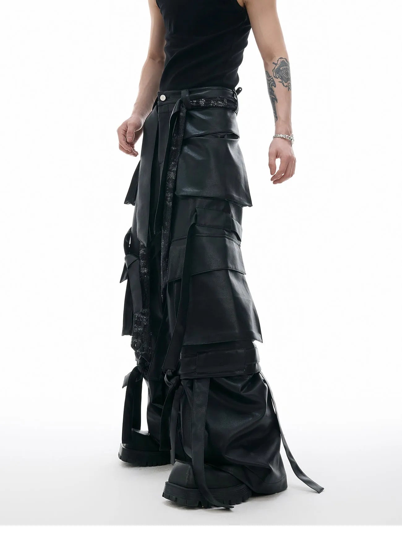 Black loose-fit quilted trousers with multiple pockets and retro stitching detail.