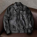 Men's black plus size loose fit PU leather jacket with lapel collar and side pockets.
