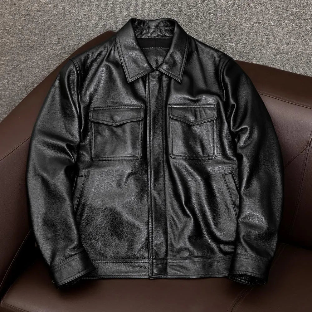 Men's black plus size loose fit PU leather jacket with lapel collar and side pockets.