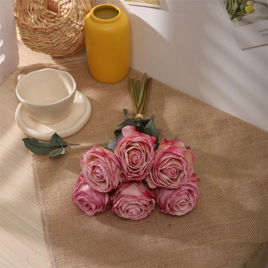 Single burnt edge simulated silk rose artificial flower with 38cm stem on neutral background