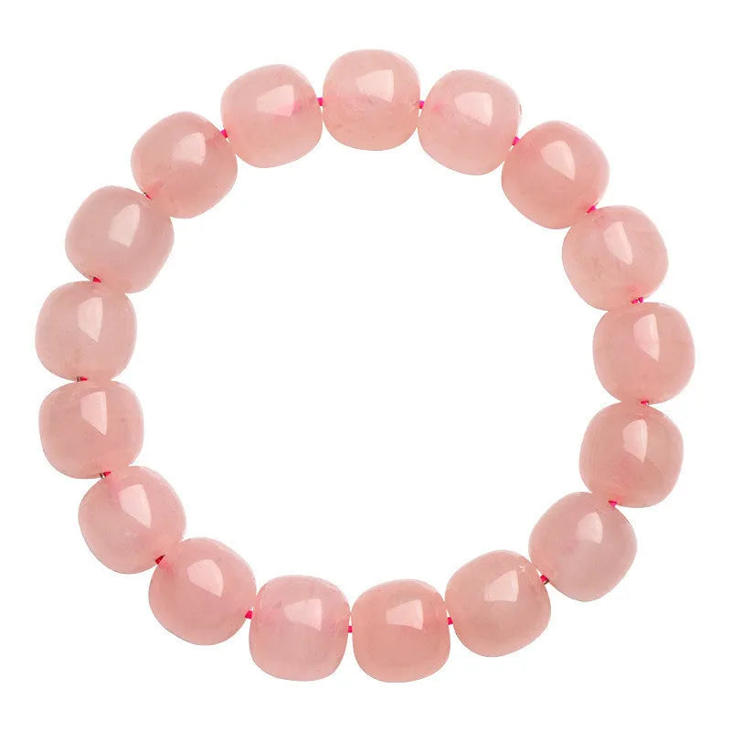 Pink natural crystal bracelet with barrel-shaped 8x10mm beads in a geometric design.